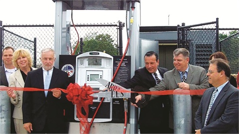 Community leaders gather for the grand opening of a compressed natural gas fueling station at Middle Country School District in Long Island in May. (L-R) Scott Zepp, Greenfield Compression; Councilwoman Kathleen Walsh, Town of Brookhaven, N.Y.; Congressman Tim Bishop; Frank Morgigno and Pat McClave, Engineered Energy Solutions; and Herb Chessler, Middle Country School District.