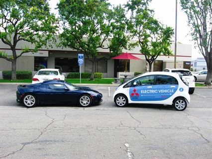 A Tesla Roadster meets a Mitsubishi i-MiEV outside the Eckhaus Fleet offices in Clovis, Calif. 